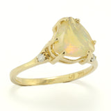 Trillium or Triangle Cut Faceted Ethiopian Opal in an Offset Gold Engagement Ring with Diamond Accents