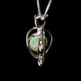 Small Ethiopian Opal Sphere in a Silver Turtle Cage Pendant on a Box Chain Necklace.