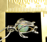 Small Ethiopian Opal Sphere in a Silver Turtle Cage Pendant on a Box Chain Necklace.