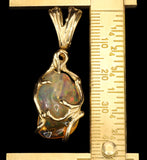 Freeform Mexican Fire Opal with Full-Spectrum Play-of-Color, in Unique, Organic Gold Pendant Setting with Spinning Bale.