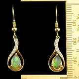 Ethiopian Opals in Flame-Shaped Setting with Diamond Accents. Gold Fishhook Earrings.