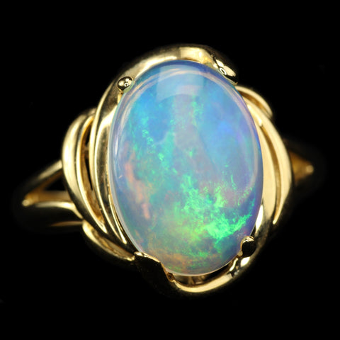 White Ethiopian Opal that seems to contain Nebulae and Galaxies set in a Modern-Style Gold Ring