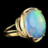 White Ethiopian Opal that seems to contain Nebulae and Galaxies set in a Modern-Style Gold Ring