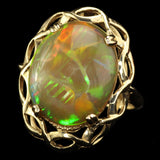 Large Ethiopian Honey Opal displaying both Honeycomb and Straw or Chaff Patterns. Set in a Vintage 1950s London Gold Ring.