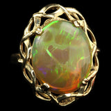 Large Ethiopian Honey Opal displaying both Honeycomb and Straw or Chaff Patterns. Set in a Vintage 1950s London Gold Ring.