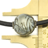 Carved Dolphin Galatea Tahitian Pearl, on black leather thong necklace