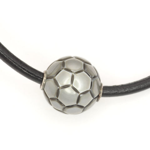 Galatea Tahitian Pearl Carved in a Soccer Ball Style, on a Black Leather Thong Necklace with Silver Clasp.
