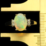Faceted Pinfire Ethiopian Opal with Diamond Accents.  Gold Ring