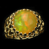 Large Ethiopian Honey Opal Cabochon with strong Orange and Green play-of-color in Gold Ring with Fancy Gallery Bezel