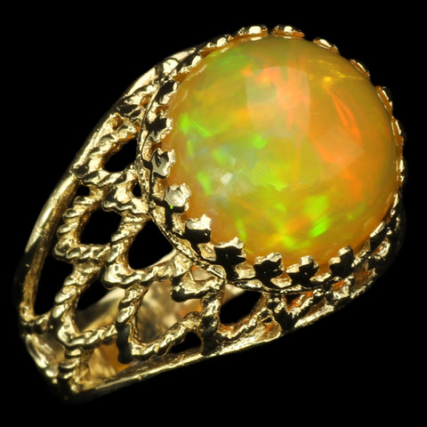 Large Ethiopian Honey Opal Cabochon with strong Orange and Green play-of-color in Gold Ring with Fancy Gallery Bezel