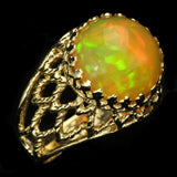 Large Ethiopian Honey Opal Cabochon with strong Orange and Green play-of-color in Gold Ring with Fancy Gallery Bezel