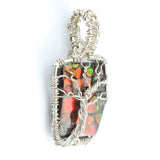 Ammolite Fossil set in a Silver Wire-Wrapped Pendant Under a Branching Tree