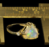 Trillium or Triangle Cut Faceted Ethiopian Opal in an Offset Gold Engagement Ring with Diamond Accents