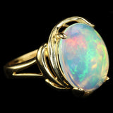 White Ethiopian Opal that seems to contain Nebulae and Galaxies set in a Modern-Style Gold Ring