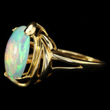 White Ethiopian Opal that seems to contain Nebulae and Galaxies set in a Modern-Style Gold Ring