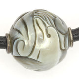 Carved Dolphin Galatea Tahitian Pearl, on black leather thong necklace