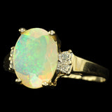 Faceted Pinfire Ethiopian Opal with Diamond Accents.  Gold Ring