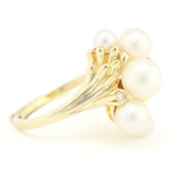 Gold Ring with Graduated Freshwater Pearls and Diamond Accents.